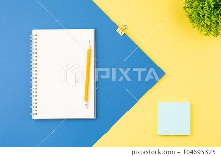 Spiral notepad with pencil on office table. Spiral notepad with pencil on office table. 104695325