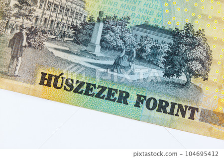 HUF cash Hungarian banknote, valued at twenty thousand forint, providing clear representation of countrys currency. 104695412