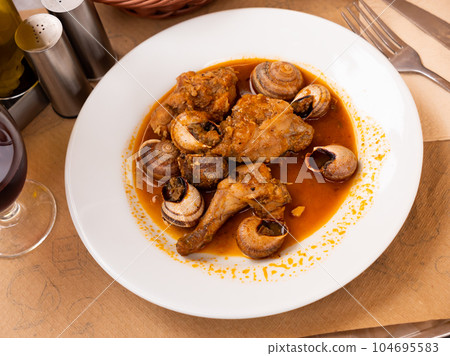 Stewed pork and potato pieces served in a plate Stewed pork and potato pieces served in a plate 104695583