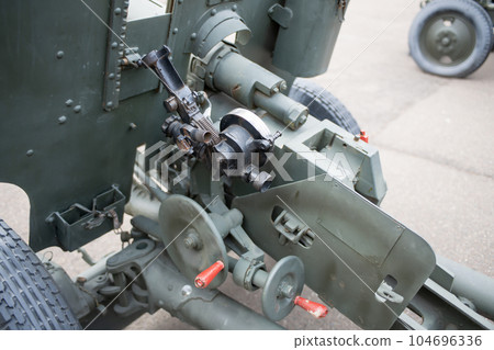 Gun guidance system at a military base in the city. Gun guidance system at a military base in the city. 104696336