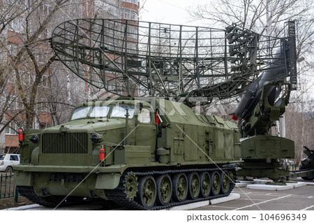 Radar antenna on a green all-terrain vehicle. Radar antenna on a green all-terrain vehicle. 104696349