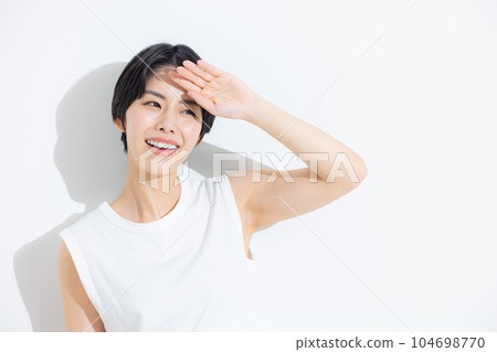 Woman in white sleeveless and denim Woman in white sleeveless and denim 104698770