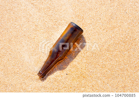 Glass bottle on the beach Glass bottle on the beach 104700885