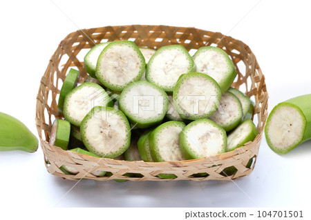 Raw banana slices on white background. 104701501