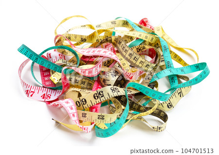 Measuring tapes on white background. 104701513