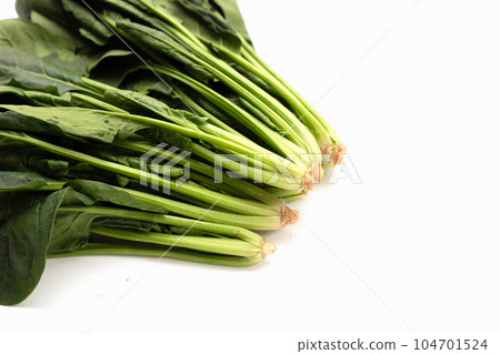 Fresh spinach on white background Fresh spinach on white background 104701524