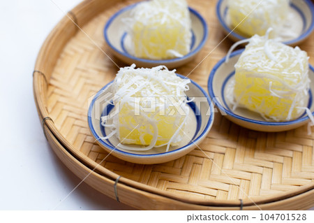 Steamed tapioca cake or cassava cake with grated coconut 104701528