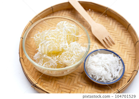Steamed tapioca cake or cassava cake with grated coconut 104701529