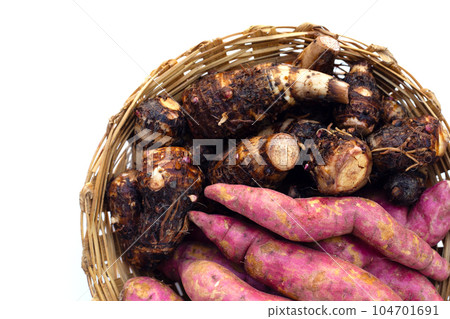 Sweet potato with taro in bamboo basket on white background. 104701691