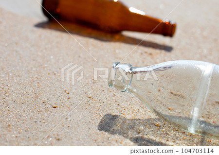 Glass bottles on the beach Glass bottles on the beach 104703114