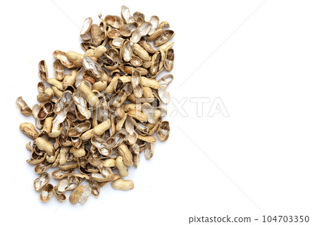 Peanut shells on white background. 104703350