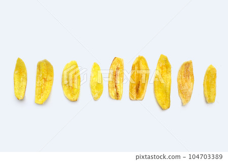 Banana slice chips on white background 104703389