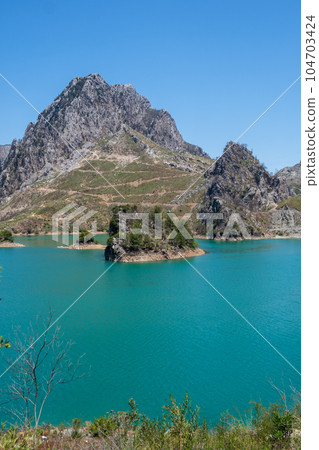 Oymapinar Lake, Turkey. Green Canyon in Manavgat region, Turkey. Emerald water reservoir behind the dam Oymapinar. A beautiful reservoir surrounded by high mountains. 104703424