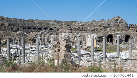 Side Ancient theatre. Turkey. Antalya. Ruins of the ancient city of Side. The largest amphitheater in Turkey. Main street of the ancient city. Mediterranean Sea. Side Ancient theatre. Turkey. Antalya. Ruins of the ancient city of Side. The largest amphitheater in Turkey. Main street of the ancient city. Mediterranean Sea. 104703441