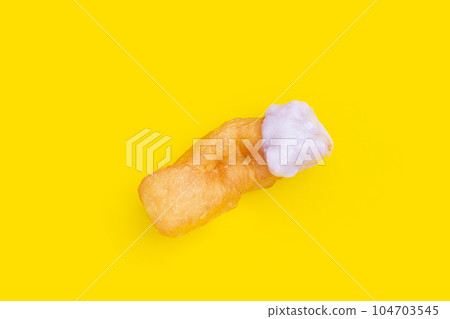 Deep-fried dough sticks or chinese bread sticks with with taro custard dip Deep-fried dough sticks or chinese bread sticks with with taro custard dip 104703545