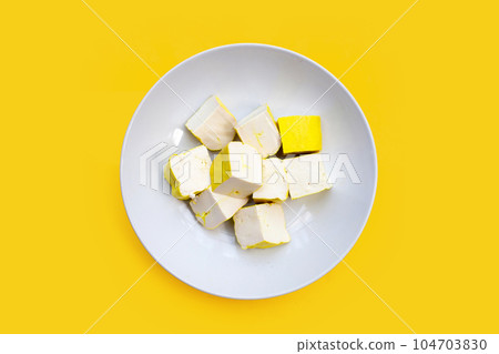 Yellow tofu on yellow background. Yellow tofu on yellow background. 104703830