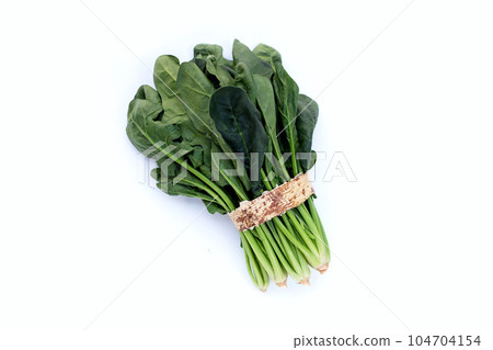 Fresh spinach on white background Fresh spinach on white background 104704154