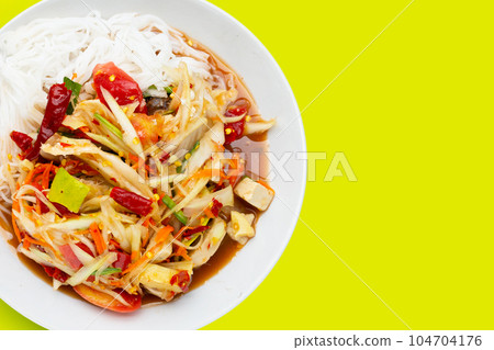 Spicy green papaya salad with vermicelli. Spicy green papaya salad with vermicelli. 104704176