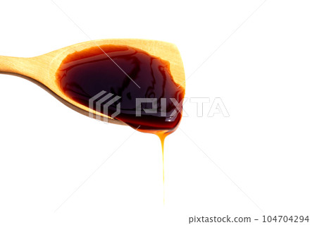Oyster sauce on white background. 104704294