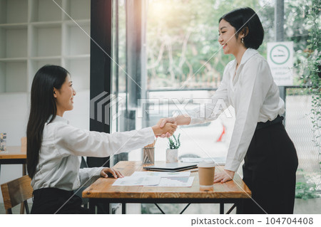 Business woman offer and give hand for handshake in office. Successful job interview. Apply for loan in bank Business woman offer and give hand for handshake in office. Successful job interview. Apply for loan in bank 104704408