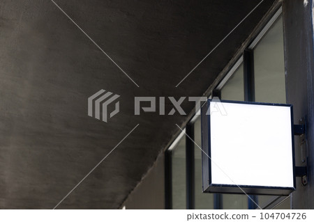 Blank sign fixed to building wall with copy space 104704726