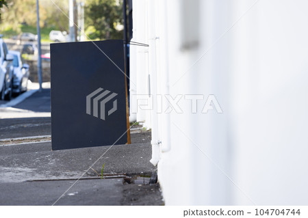 Blank sign standing on pavement with copy space Blank sign standing on pavement with copy space 104704744