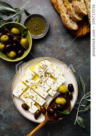 Feta cheese, olives and ciabatta, top view 104713556