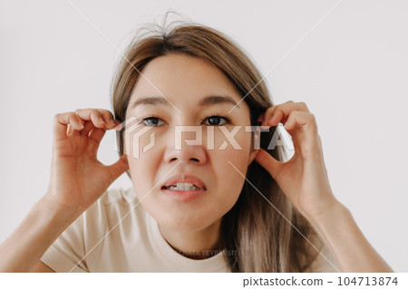 Woman make funny teasing face for humor isolated on white. 104713874