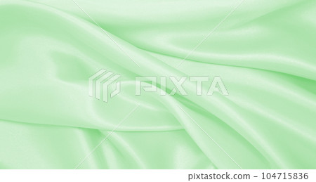 Smooth elegant green silk or satin luxury cloth texture as abstract background. Luxurious background design Smooth elegant green silk or satin luxury cloth texture as abstract background. Luxurious background design 104715836