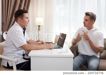 male Doctor talking to patient in office male Doctor talking to patient in office 104716736