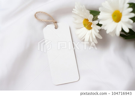 A mock - up of a white and brown empty tag with a rope 104716943