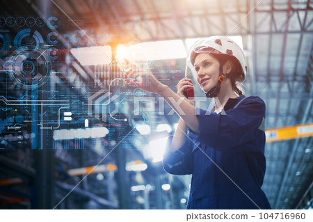 Engineer woman with advanced digital computer technology overlay control touch screen operation monitor industry factory  process happy smiling. 104716960