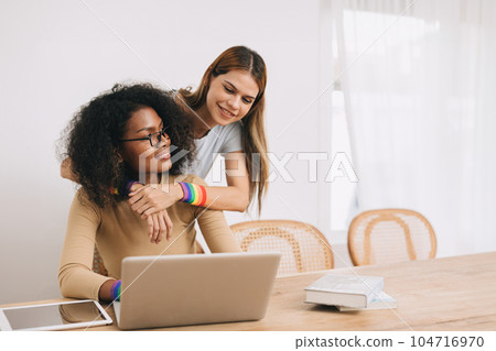 Couple woman lover LGBT family living together share love care looking together at home Couple woman lover LGBT family living together share love care looking together at home 104716970