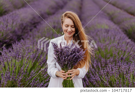 Woman Holding Purple Lavender Flower Bouquet 104717817