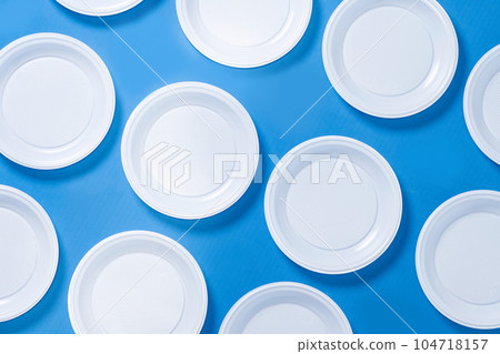 Disposable waste plastic on blue background 104718157