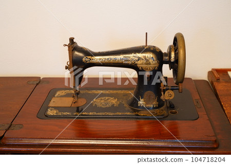 Landscape with an old sewing machine Landscape with an old sewing machine 104718204