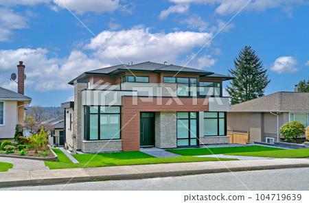 Modern family house on cloudy sky background Modern family house on cloudy sky background 104719639
