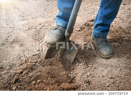 Leg with a shovel. Man digging 104719714