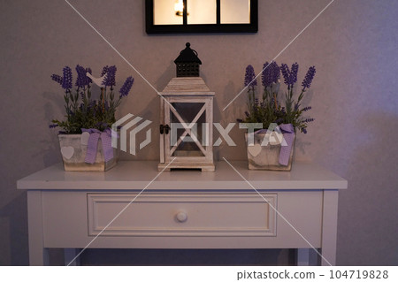 Home decor in the style of Provence, a table with a retro lantern and Lavender baskets. 104719828