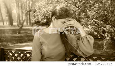 Pretty girl sitting on the bench Pretty girl sitting on the bench 104720496