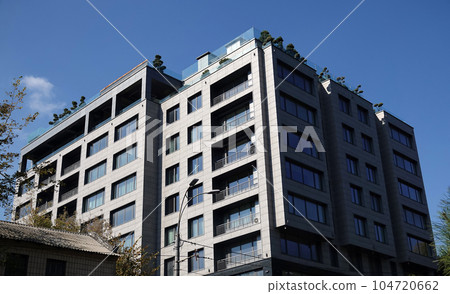 Kiev, Ukraine October 2, 2021: Modern new building with a winter garden on the roof in the city of Kiev Kiev, Ukraine October 2, 2021: Modern new building with a winter garden on the roof in the city of Kiev 104720662