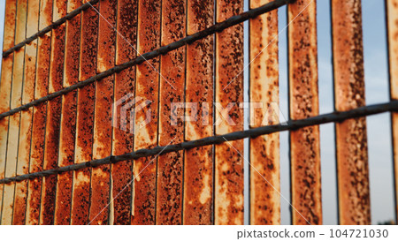 Rusty and corroded iron grate Rusty and corroded iron grate 104721030