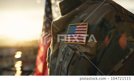 American flag on chest of military man praying for memorial day American flag on chest of military man praying for memorial day 104721515