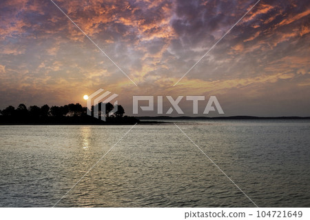 Sunset on the beach 104721649