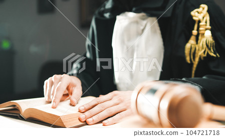 Judge reads the sentence to be afflicted on the criminal in the courtroom 104721718