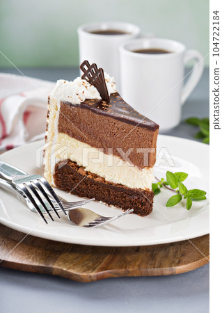 Three chocolate layer mousse cake Three chocolate layer mousse cake 104722184