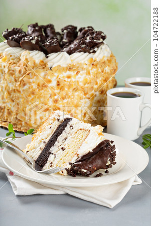 Italian cake with chocolate cannoli on top Italian cake with chocolate cannoli on top 104722188