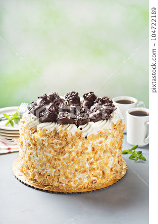 Italian cake with chocolate cannoli on top Italian cake with chocolate cannoli on top 104722189