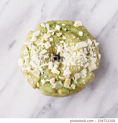 Matcha donut on marble surface 104722208