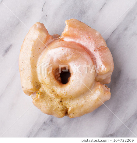 Vanilla donut closeup on marble 104722209